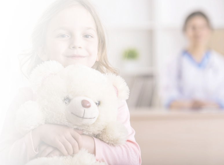 little girl holding a teddy bear
