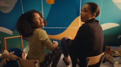 girl in care center drawing